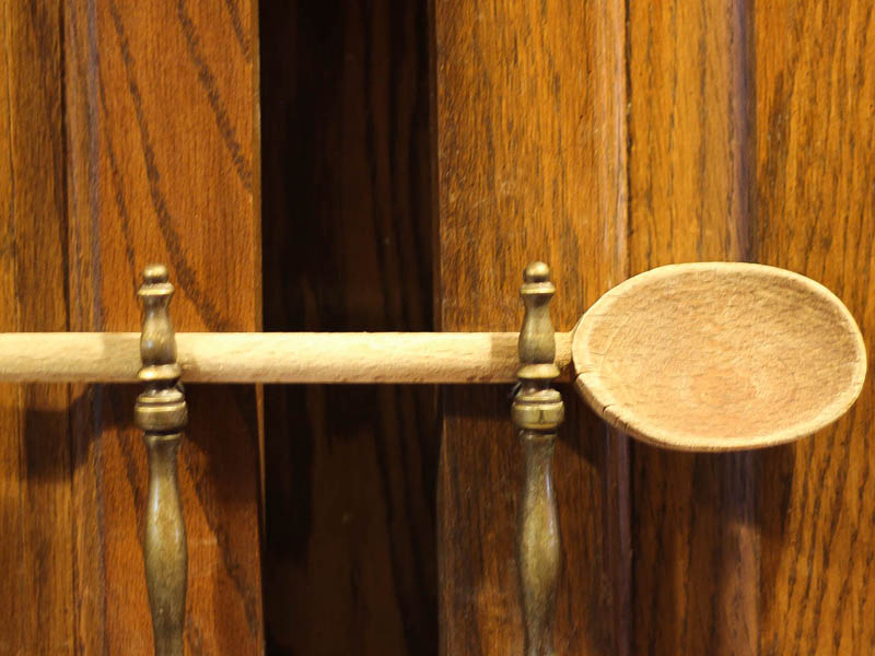 latching a cupboard with a spoon