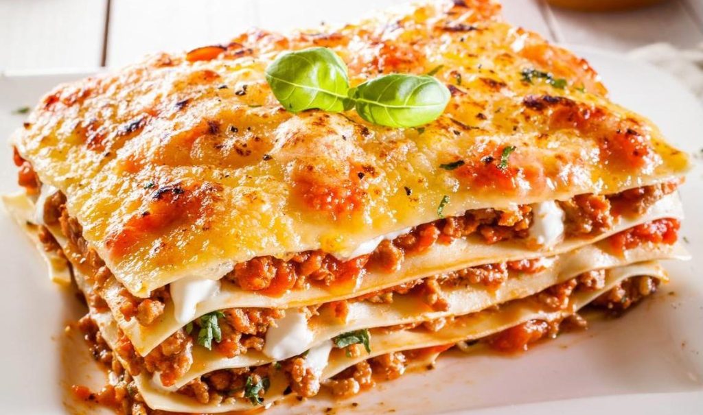 Portion of lasagne with bolognese and cheese