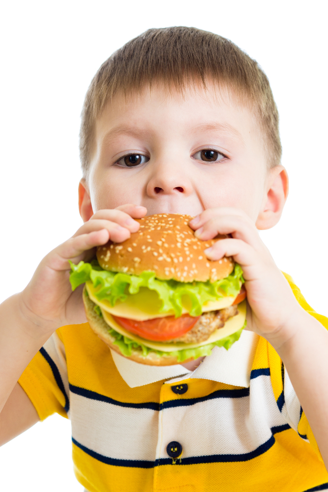kid-boy-eating-delicious-hamburger-