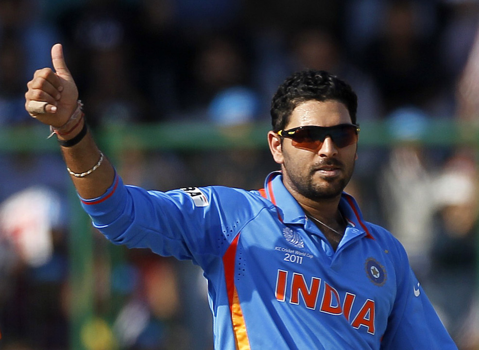 India's Yuvraj Singh celebrates taking the wicket of The Netherlands' Wesley Baressi during their ICC Cricket World Cup group B match in New Delhi