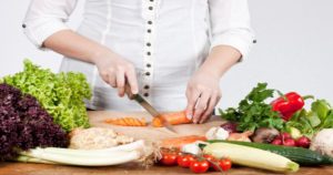 Woman cutting vegetables_compressed