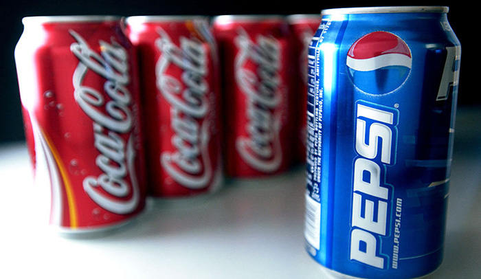 Cans of Pepsi and Coke are set up for a photograph in New Yo