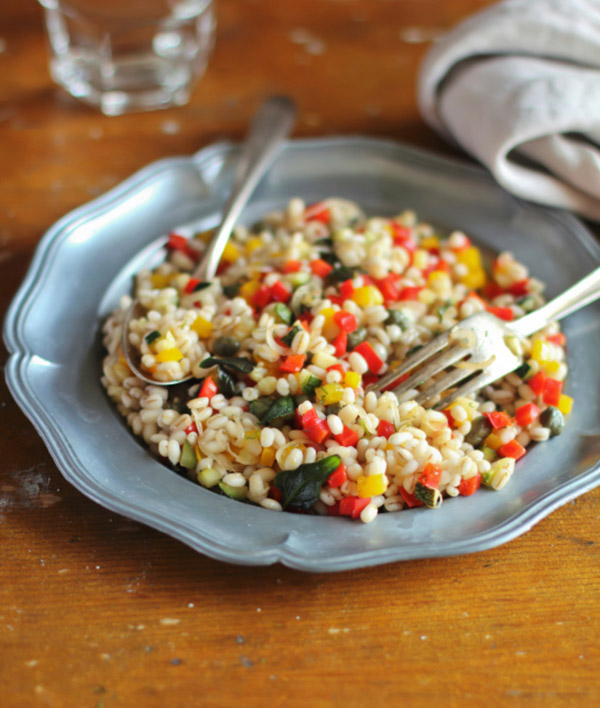 Warm salad with red and yellow pepper, barley
