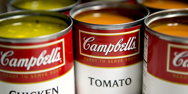 Cans of Campbell Soup Co. Campbell's chicken noodle and tomato soup are arranged for a photograph in Washington, D.C., U.S., on Monday, Nov. 19, 2012. Campbell Soup Co. is scheduled to release earnings data on Nov. 20. Photographer: Andrew Harrer/Bloomberg via Getty Images
