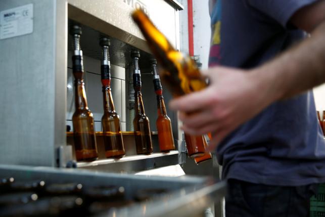 An employee works at Herzl Brewery in Jerusalem