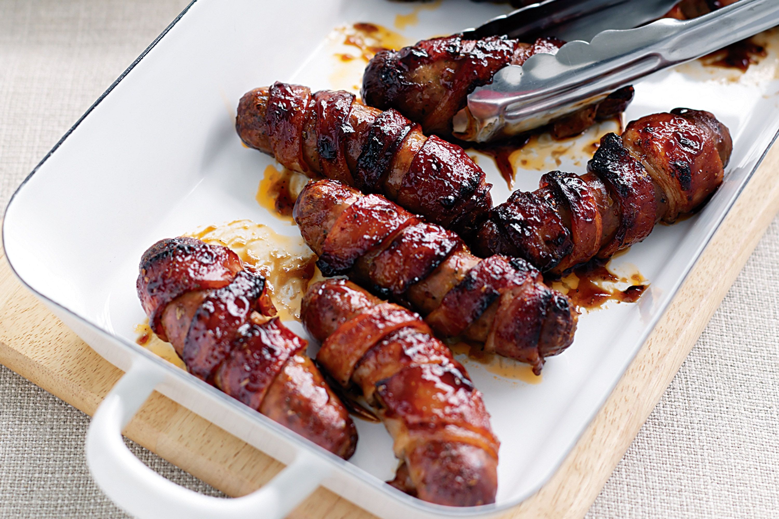 sticky-bacon-wrapped-sausages